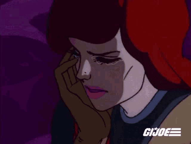 a cartoon of a woman with red hair crying while holding her hand to her face .