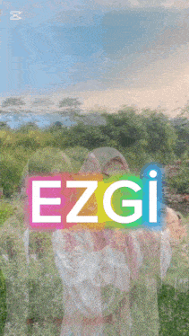 a woman in a hijab is standing in a field with the word ezgi on the rainbow background