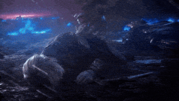 a woman is laying on the ground with a sword in her hand