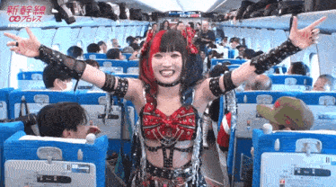 a woman in a gothic outfit is standing on a plane