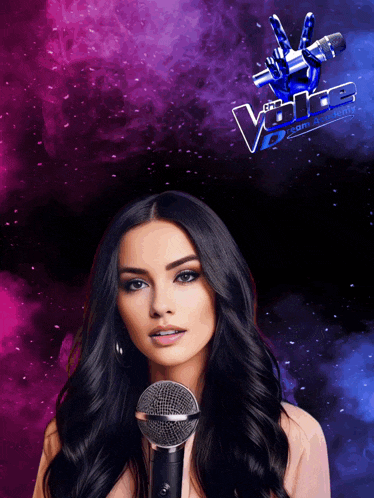 a woman holds a microphone in front of a sign that says the voice