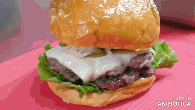 a hamburger on a bun with lettuce and cheese is made in animatica