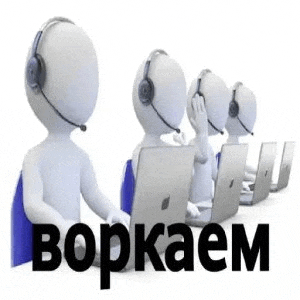a group of people wearing headsets are sitting at laptops .