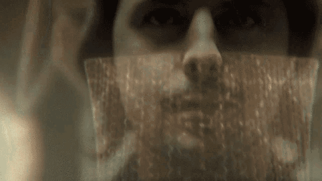 a blurred image of a person 's face with a beard