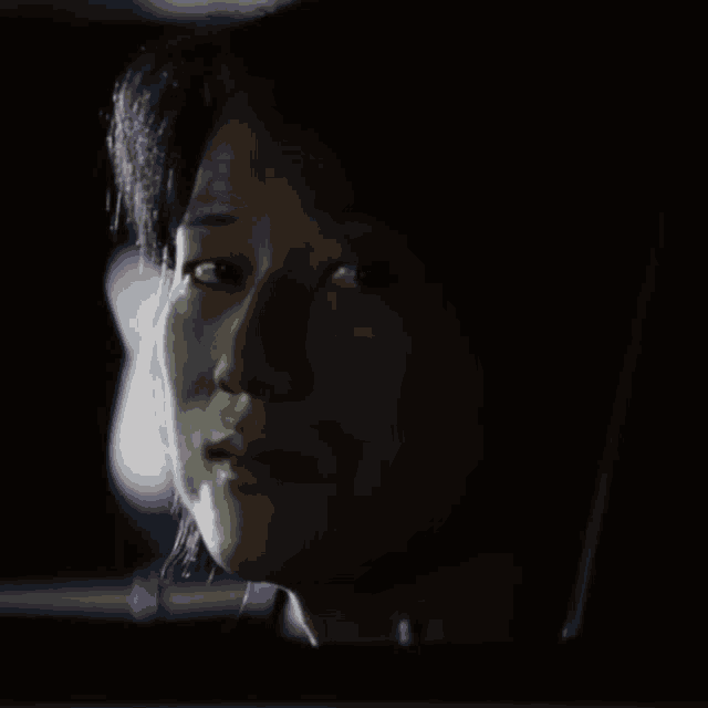 a close up of a woman 's face in a car