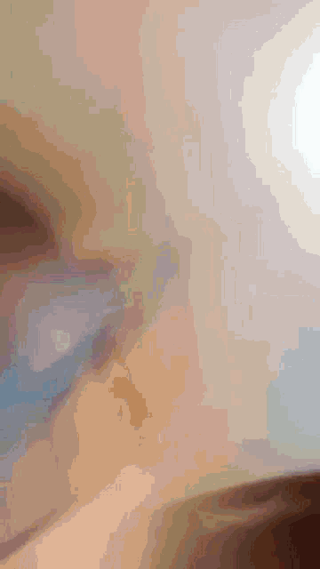 a close up of a person 's face with a blurred image