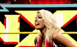 a pixelated image of a woman in a wrestling ring with the letter x behind her