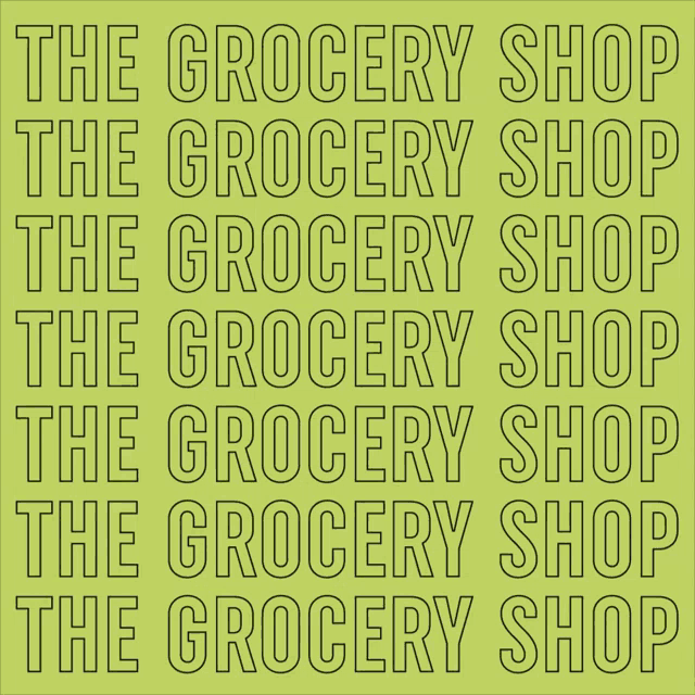 a sign that says the grocery shop in black on a green background