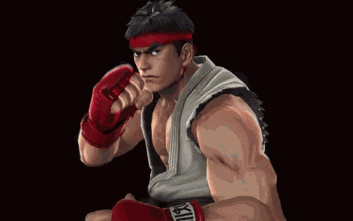 a man wearing red boxing gloves that say kill on the wrist