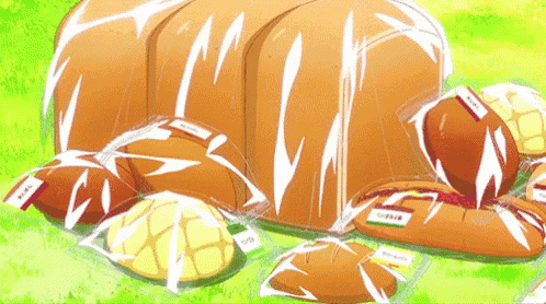 a large loaf of bread is surrounded by smaller breads