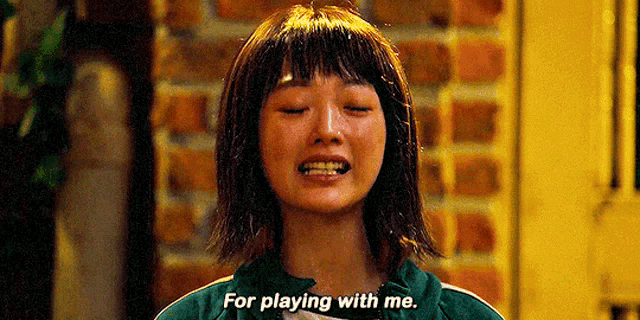 a woman is crying and saying `` for playing with me '' .