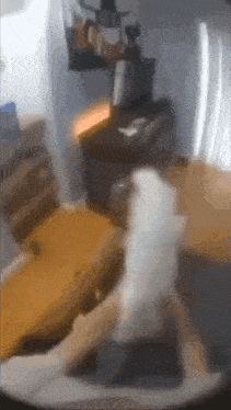 a blurry picture of a person sitting on a chair