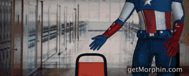 a superhero is standing in a hallway with the website getmorphin.com in the background