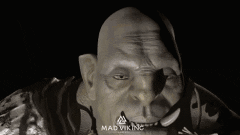 a statue with the word mad viking on the bottom right