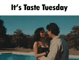 a man and a woman are kissing in front of a pool with the words it 's taste tuesday above them