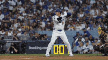 a baseball player with the number 17 on his jersey is getting ready to bat