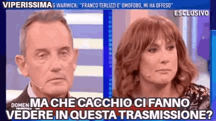 a man and a woman are on a television show and the woman is asking the man if he can see her in the transmission