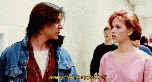 a man and a woman are standing next to each other and the woman is asking the man if being bad feels pretty good
