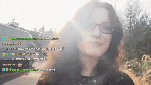 a woman wearing glasses stands in front of a screen that says discount season letty