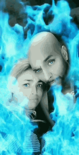 a man and a woman are surrounded by blue flames and smoke