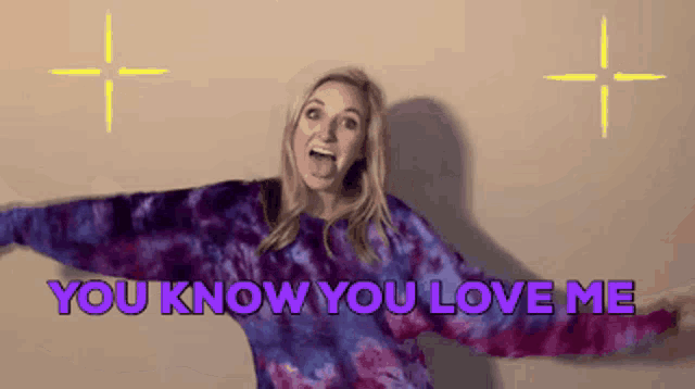 a woman in a purple tie dye sweater says " you know you love me "