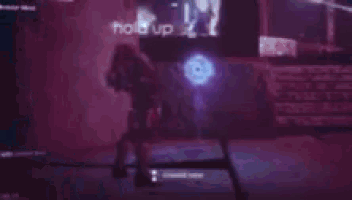 a ghost is appearing in a dark room with a blue light coming from it .