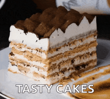 a white plate with a slice of cake and the words tasty cakes