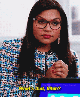 a woman wearing glasses says " what 's that bitch " while sitting in front of a tablet