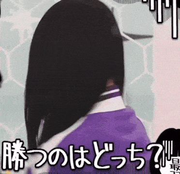 a woman in a purple shirt is standing in front of a wall with japanese writing