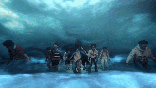 a group of zombies walking in the water with one wearing a shirt that says ' a ' on it