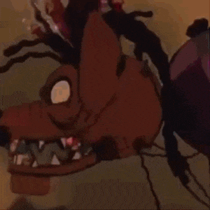 a close up of a cartoon character 's face with a huge mouth and teeth .