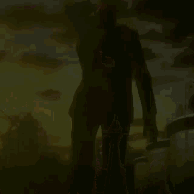 a man in a suit stands in front of a sunset sky