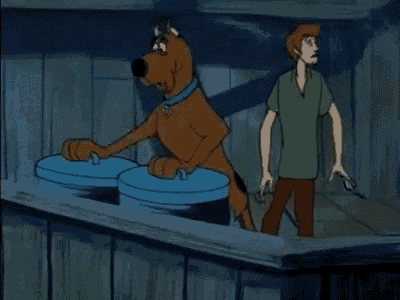 scooby doo and shaggy are standing next to trash cans with their lids open