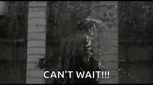 a black and white photo of a person standing in the rain with the words `` can 't wait '' .
