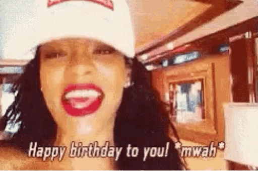 a woman wearing a hat and red lipstick is saying `` happy birthday to you ! ''