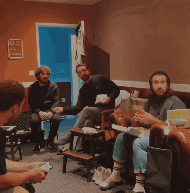 a blurry photo of a group of people playing with a ball
