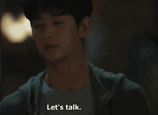 a man says let 's talk while looking down