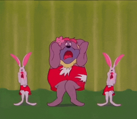 a cartoon elephant and two rabbits are dancing on a stage in front of a green curtain .