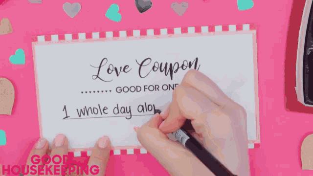 a person is writing a love coupon that says good for one whole day also