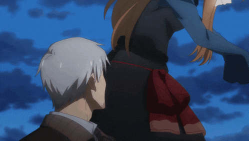 a man and a woman are standing next to each other in a blue sky