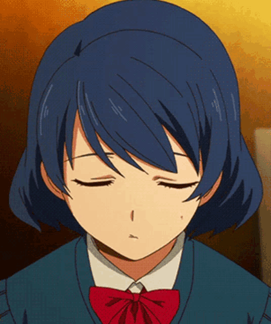 a girl with blue hair is wearing a red bow tie