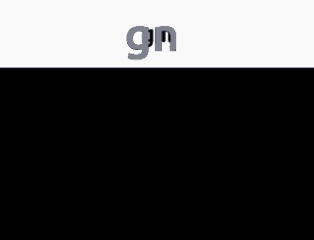 a man in a suit and tie is standing in front of a sign that says " gn "
