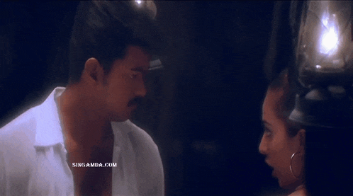 a man and a woman are looking into each other 's eyes with the website singamda.com in the corner