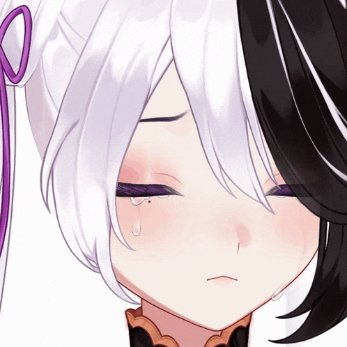 a close up of a girl 's face with tears coming out of her eyes