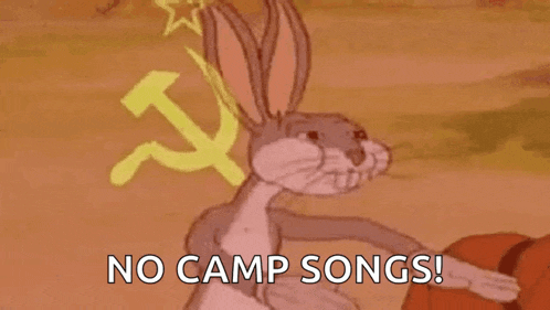 bugs bunny is wearing a hammer and sickle on his head and holding a basketball .