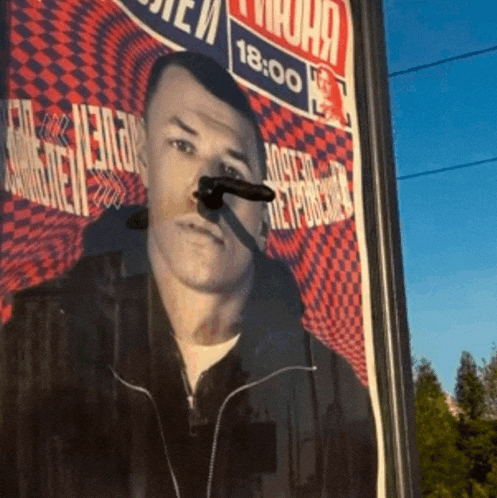 a picture of a man with a gun sticking out of his nose with the time 18:00