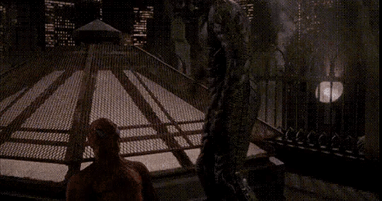 a man in a superhero costume is standing in front of a fence with the words " ну привет " in white letters