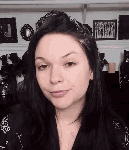 a woman wearing a black and white shirt with the letters r & s on it