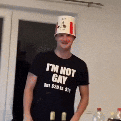 a man wearing a kfc bucket hat and a t-shirt that says i 'm not gay