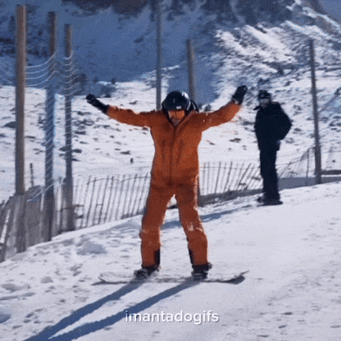 a man in an orange suit is standing on a snowboard with the words imantadogifs below him
